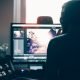 Person editing a YouTube video on computer